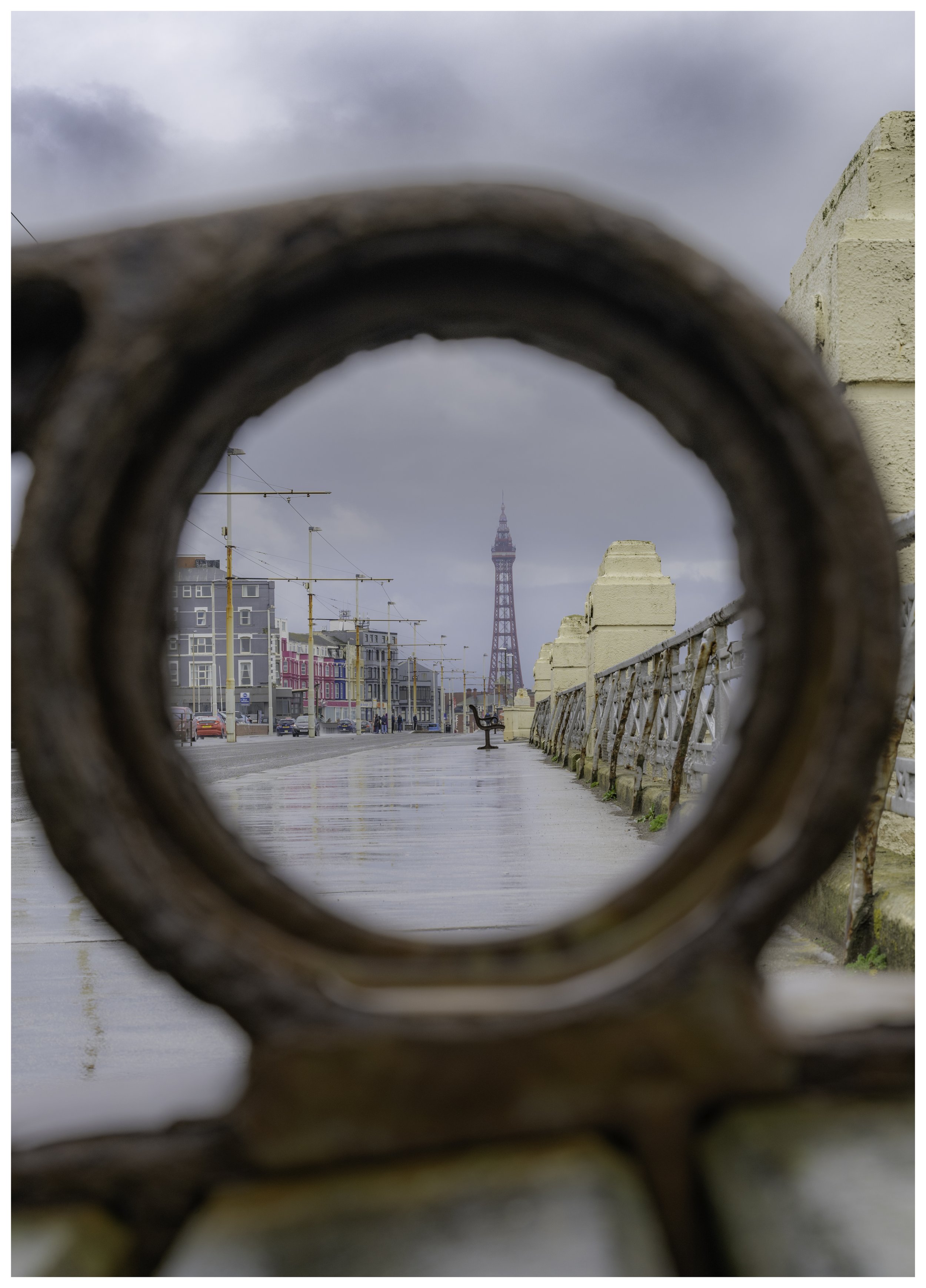 Blackpool Tower through the arm support of a street chair